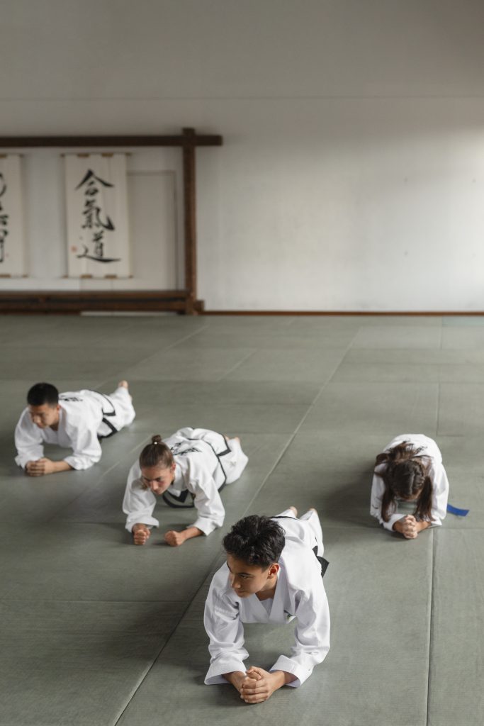 full-shot-asian-people-practicing-taekwondo.jpg